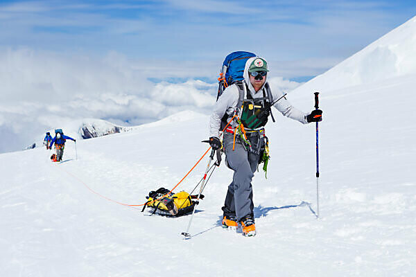 Bildagentur mauritius images Ski mountaineers and rangers on