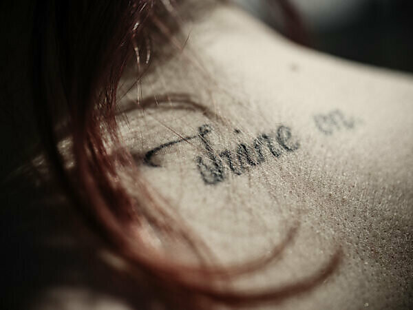 Tattoo on the neck of a girl