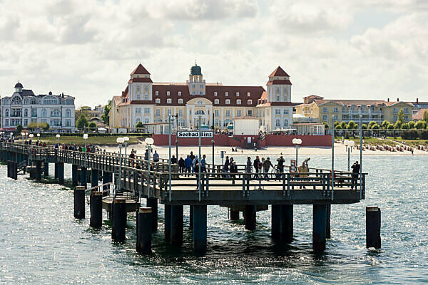 Baltic Sea, seaside resort Binz, spa house and pier with steamer landing, tourists waiting