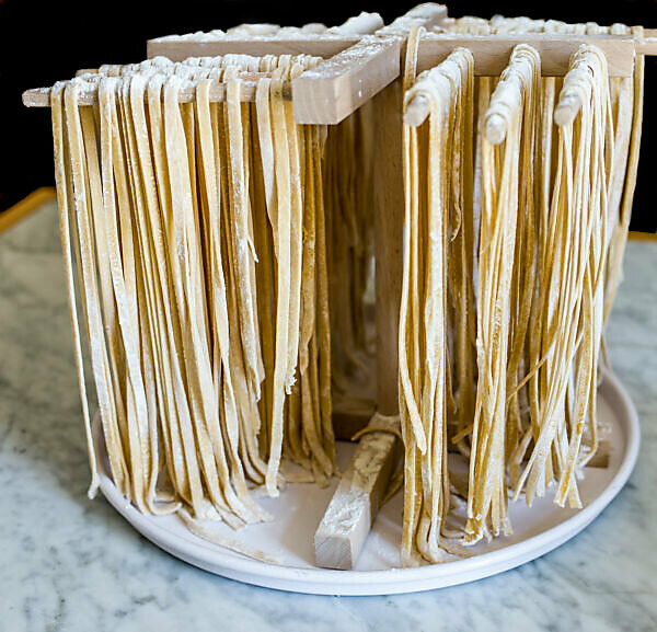 Bildagentur Mauritius Images Close Up Of Raw Pasta On Wooden Stand